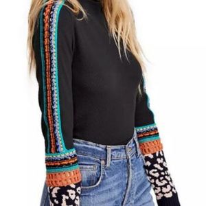 NWT Free People switch it up thermal top with crocheted sleeves. Rounded hem.